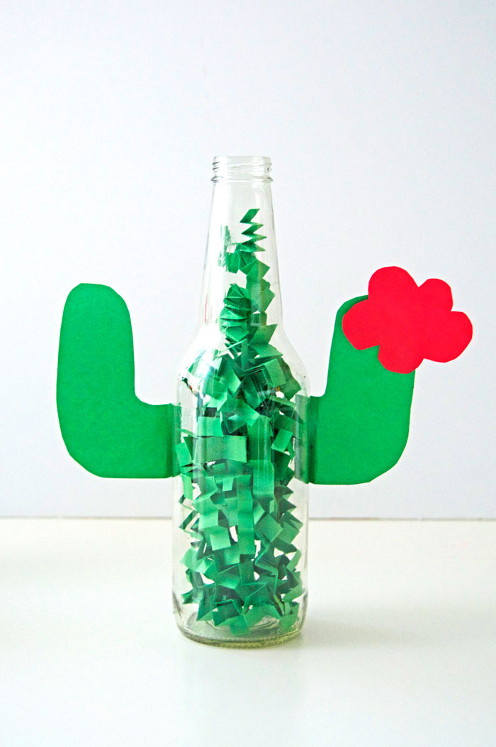 DIY one schnazzy centerpiece for your Cinco de Mayo party! Just grab an empty IZZE bottle, construction paper, scissors and tape. | dcgirlinpearls.com